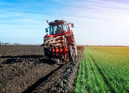 Tractor ploughing and planting